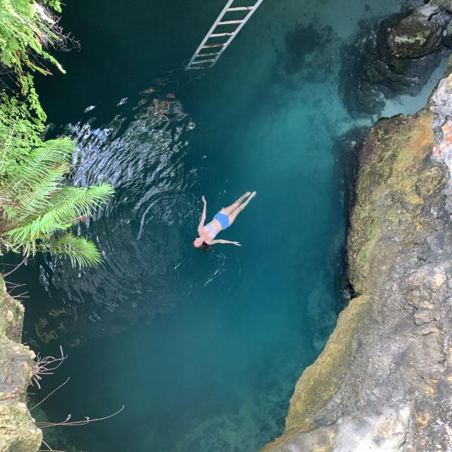 Aerial view of woman swimming in the Blue Hole, Jamaica