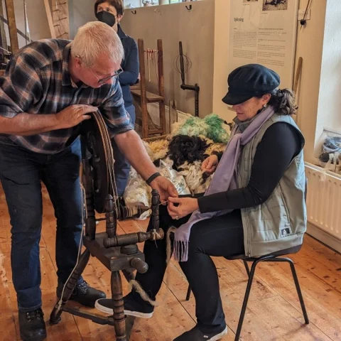 A picture of two people at Sheep wool centre.