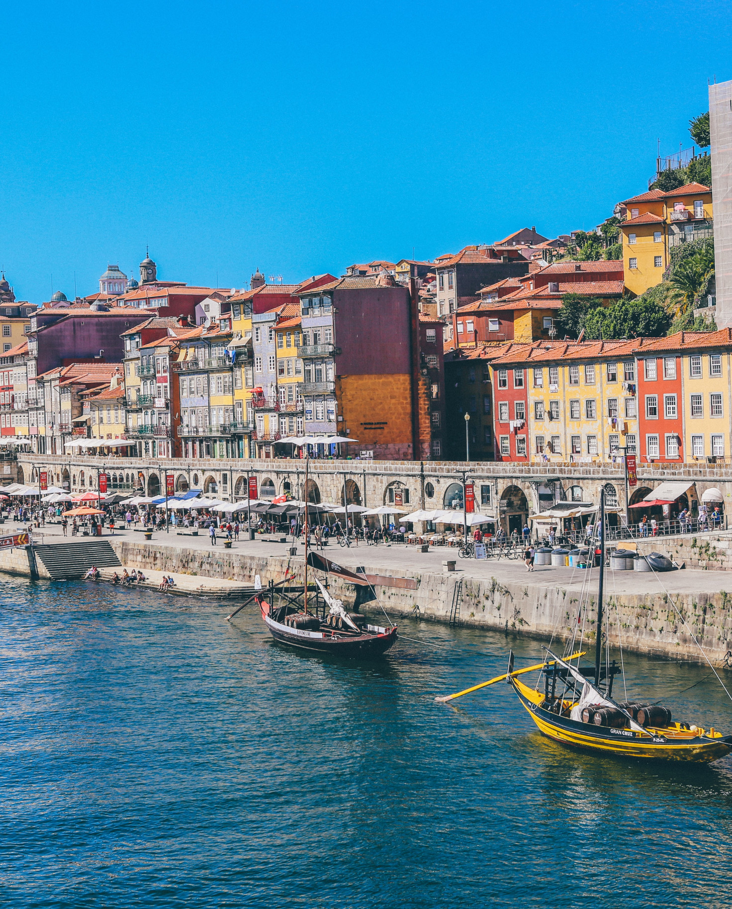 View of boats in the water and colorful houses in Portugal