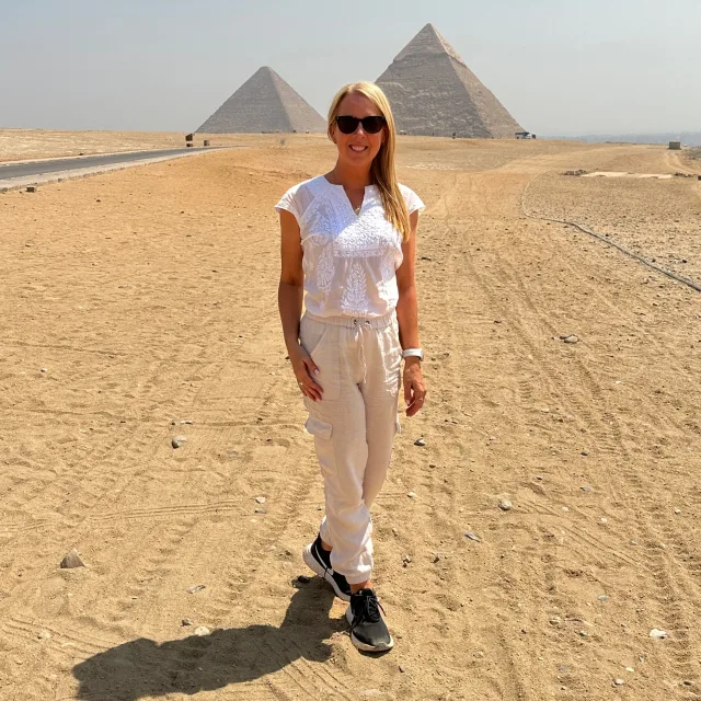 Travel advisor posing in a desert