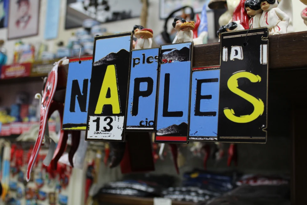Naples written on a board in multi colors