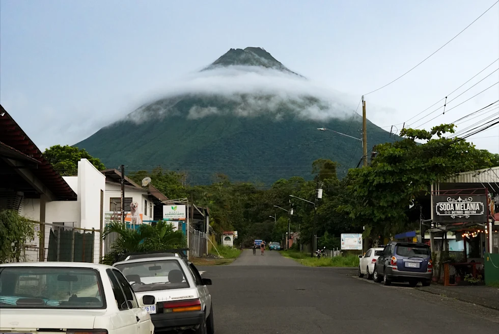 road with large volcano in the background