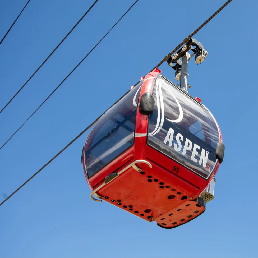 red gondola with the words "Aspen."