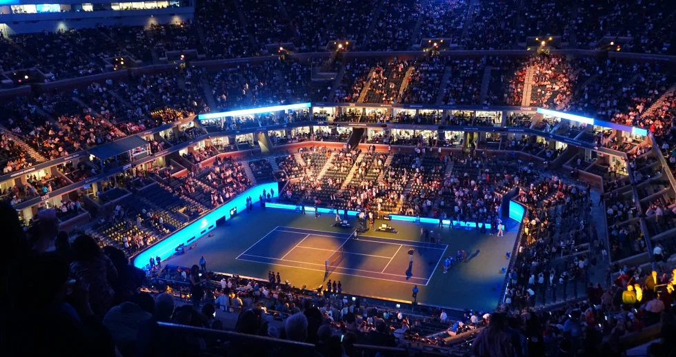 aerial view of large, crowded tennis stadium