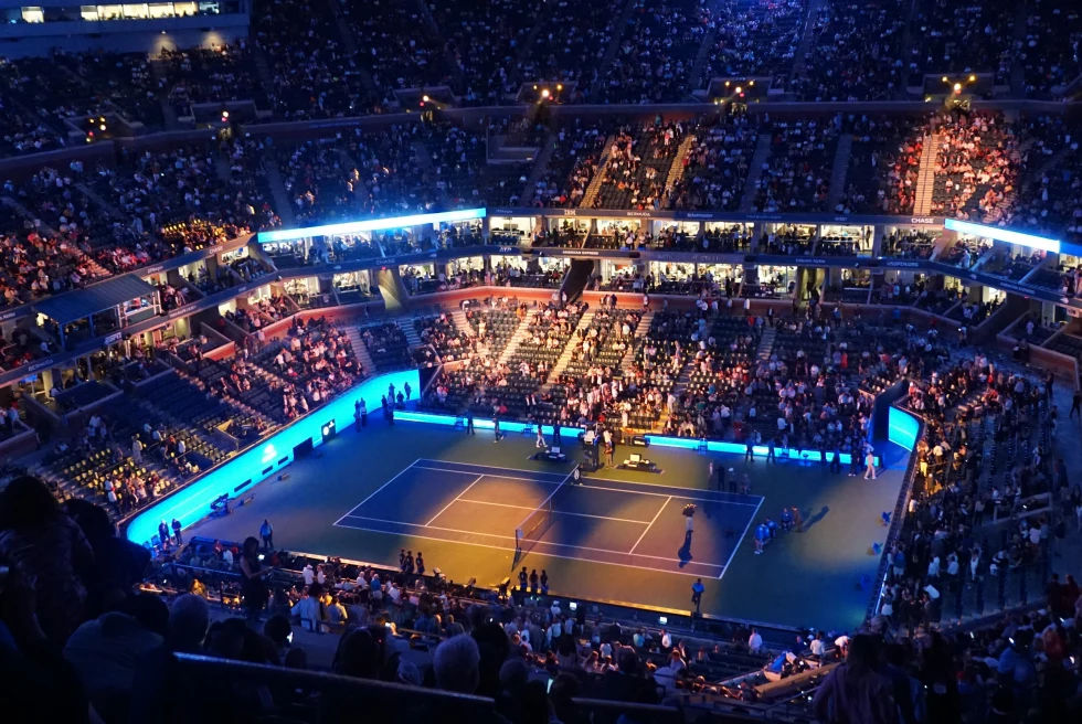 aerial view of large, crowded tennis stadium