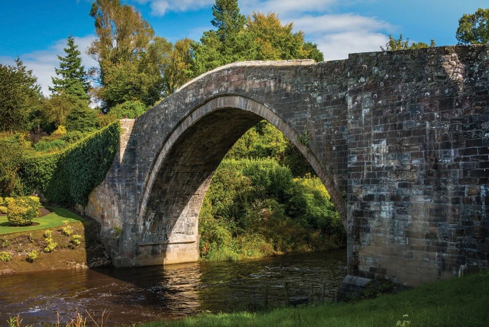 Brig o' Doon is a picturesque stone bridge immortalized in literature, spanning the Doon River and evoking romantic charm in the Scottish countryside.