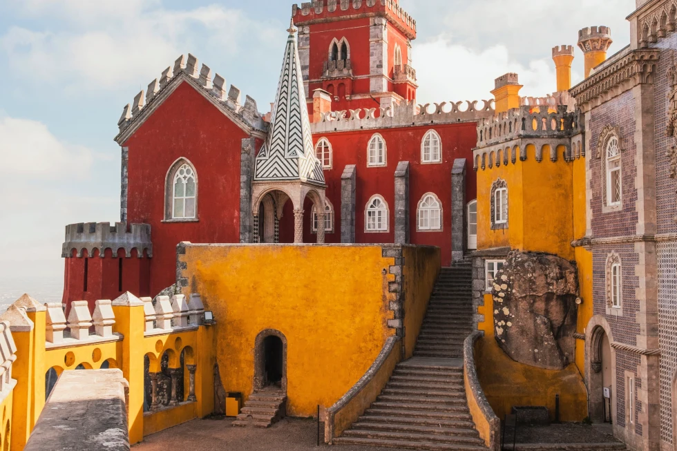 A yellow and rust building which looks like a castle.