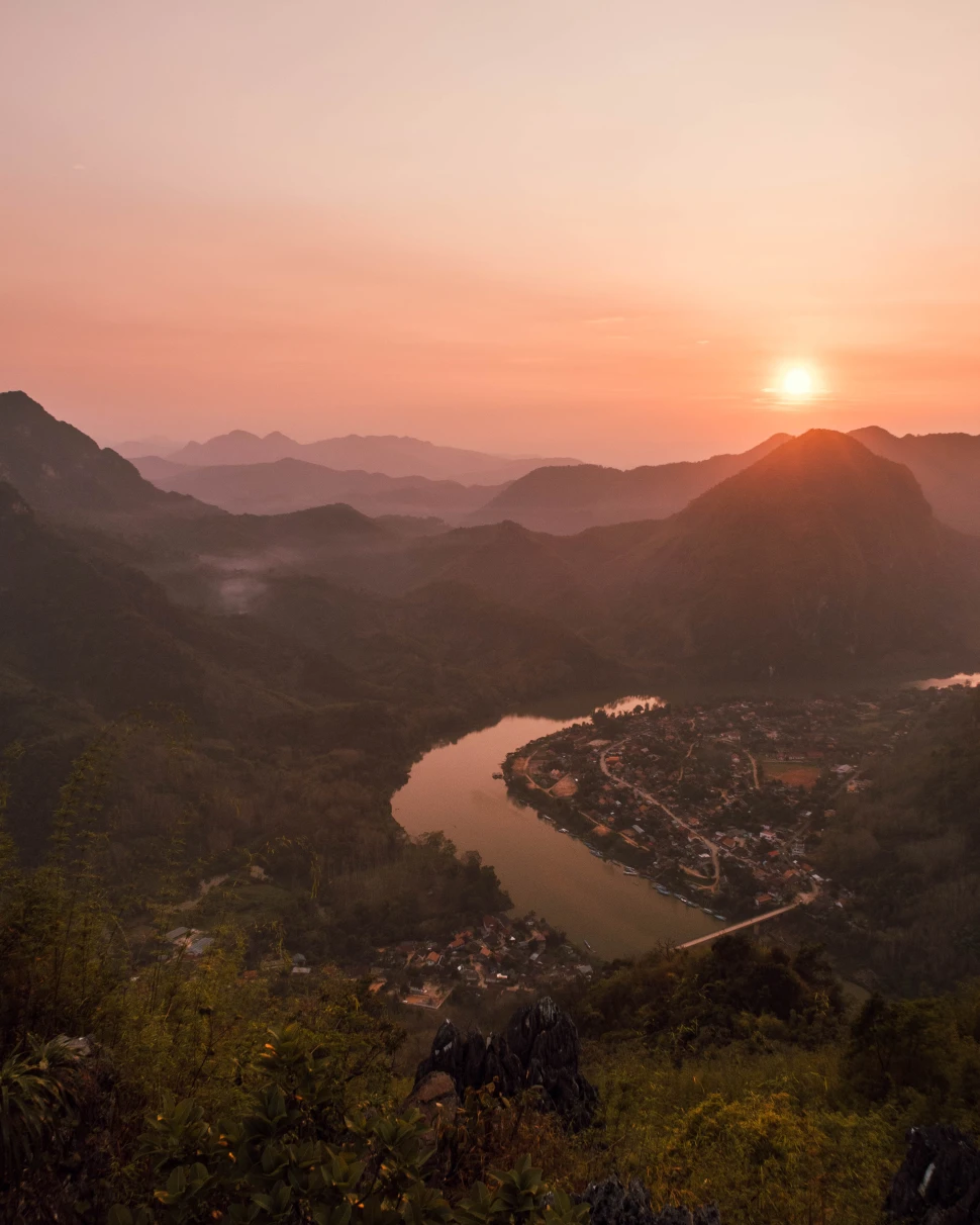 Sunset over the river and mountains in Laos. 