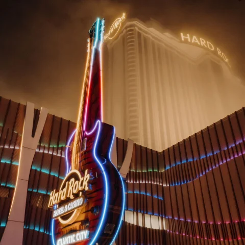 A view of the Hard Rock Café neon guitar sign outside. 