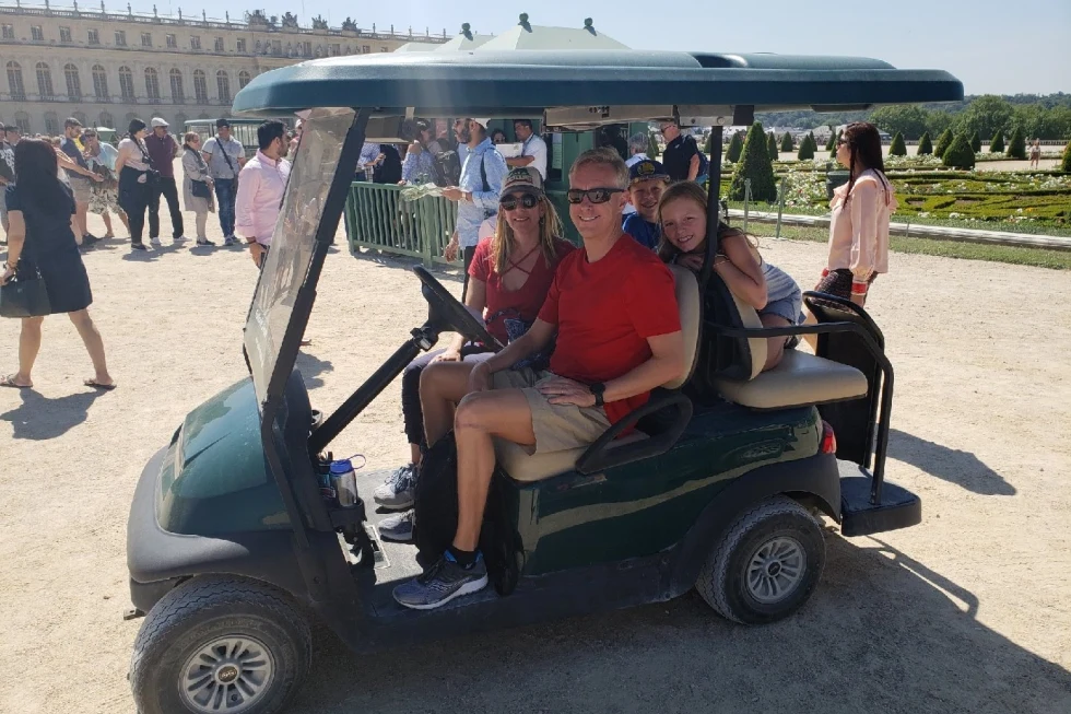 Family of Travel Advisor Caroline Weilert on a golf cart. 