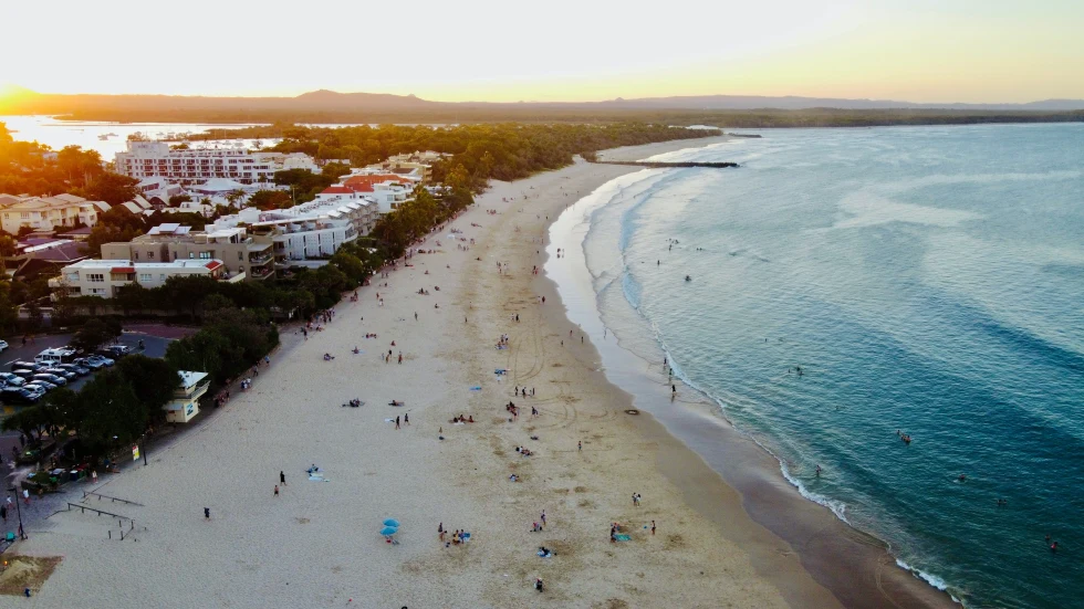 aerial view of beach and ocean during sunset