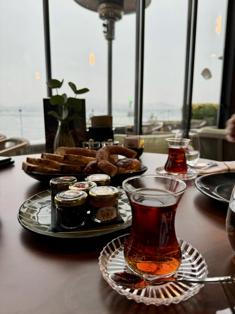 A table set of traditional Turkish tea, pastries and jams and breakfast items.