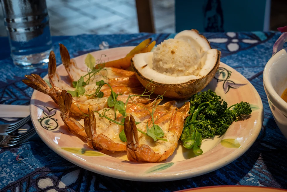A close shot of Prawns served in a plate with coconut.
