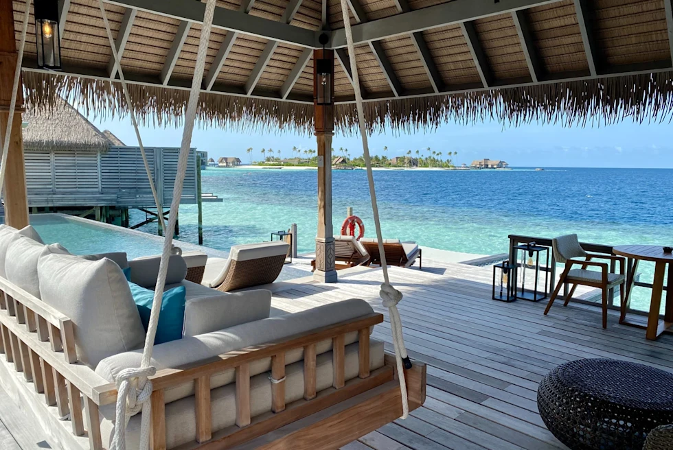 hanging couch on an overwater deck