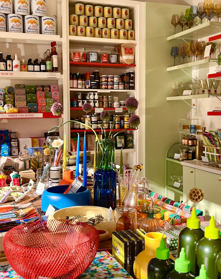 a store filled with colorful home goods and pantry fare