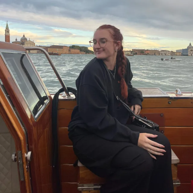 Picture of Kylee in black dress in boat