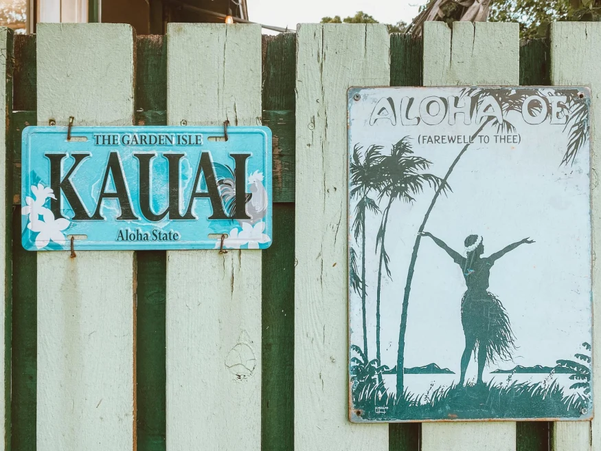 Hawaii Signs on Fence.
