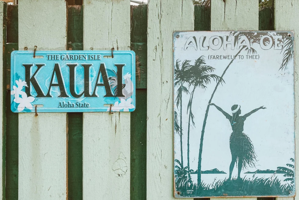 Hawaii Signs on Fence.
