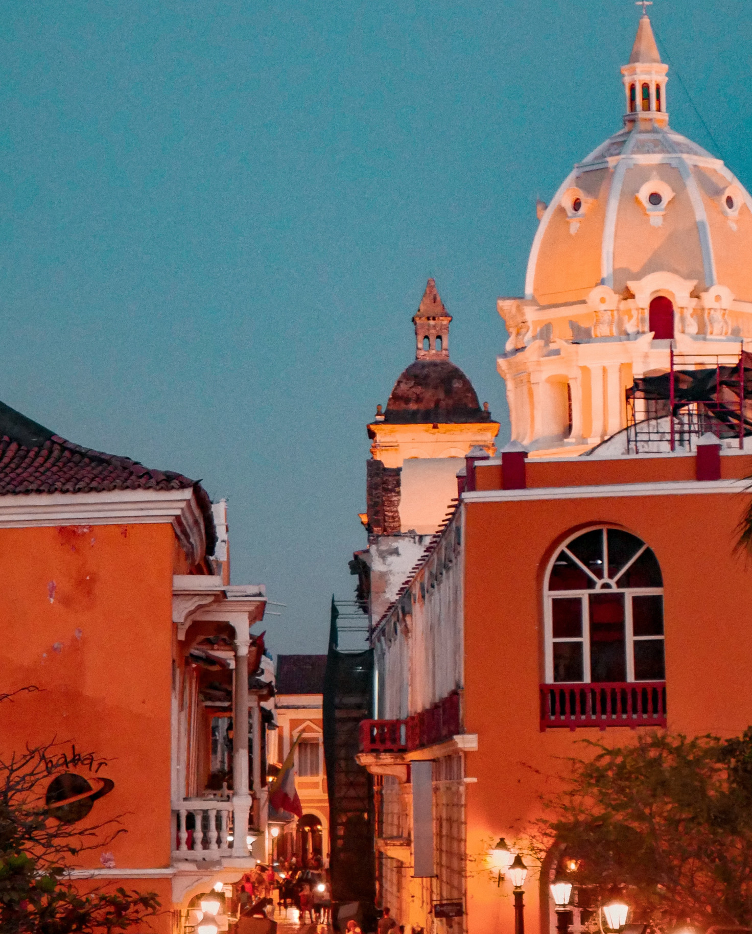 orange buildings next to street during nighttime