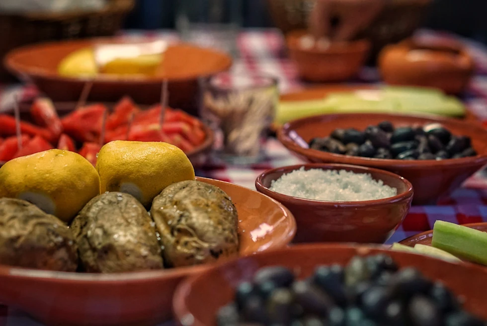 Traditional Greek meal with olives, mezes and more.