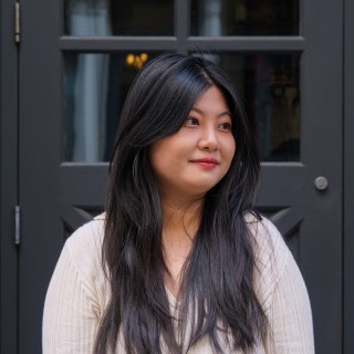 Fora's Product Designer Anna Yang smiling away from the camera