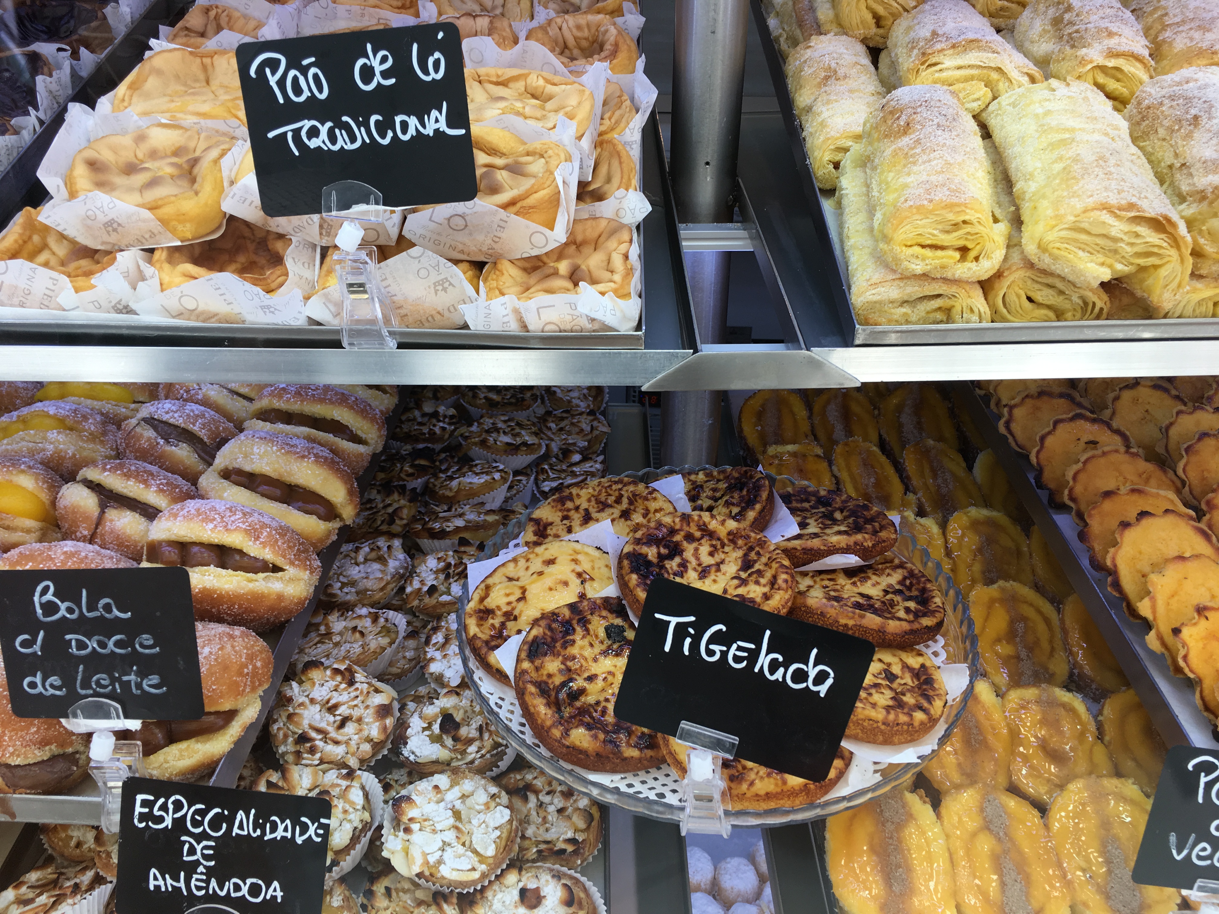 trays of food with black signs