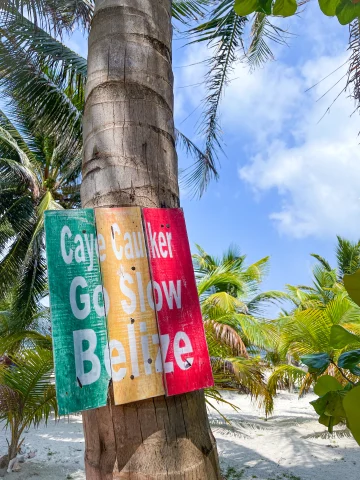 A written, colorful sign in Belize. 