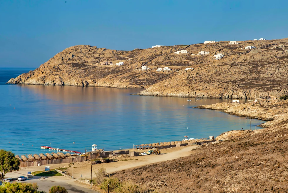 Body of water next to sandy beach during daytime