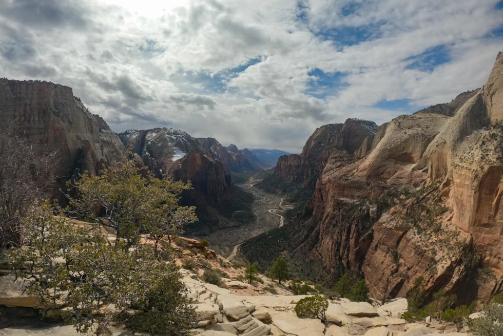 large canyon in massive mountain range on a sunny day