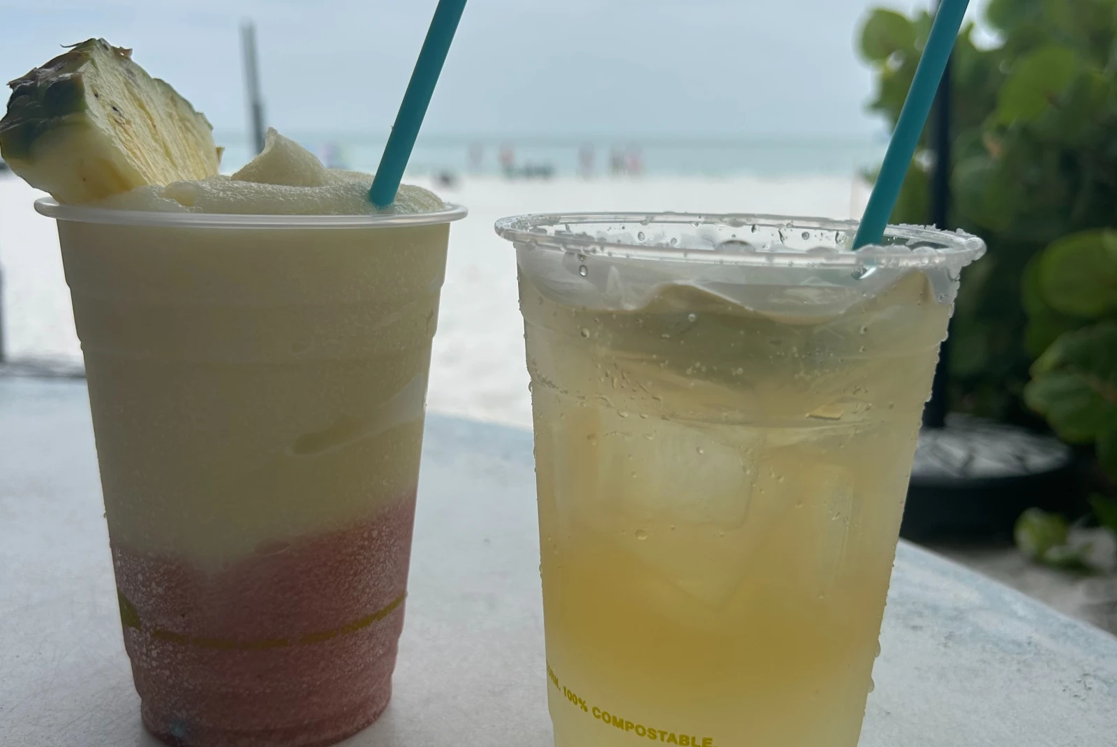 Sipping some cocktails while enjoying the nice beach view.