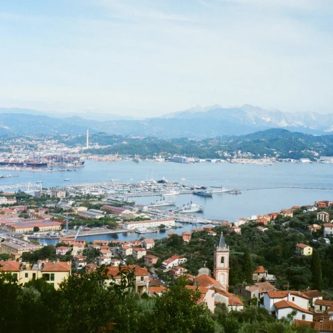 An aerial view of La Dolce Vita Italy with sea and buildings. 