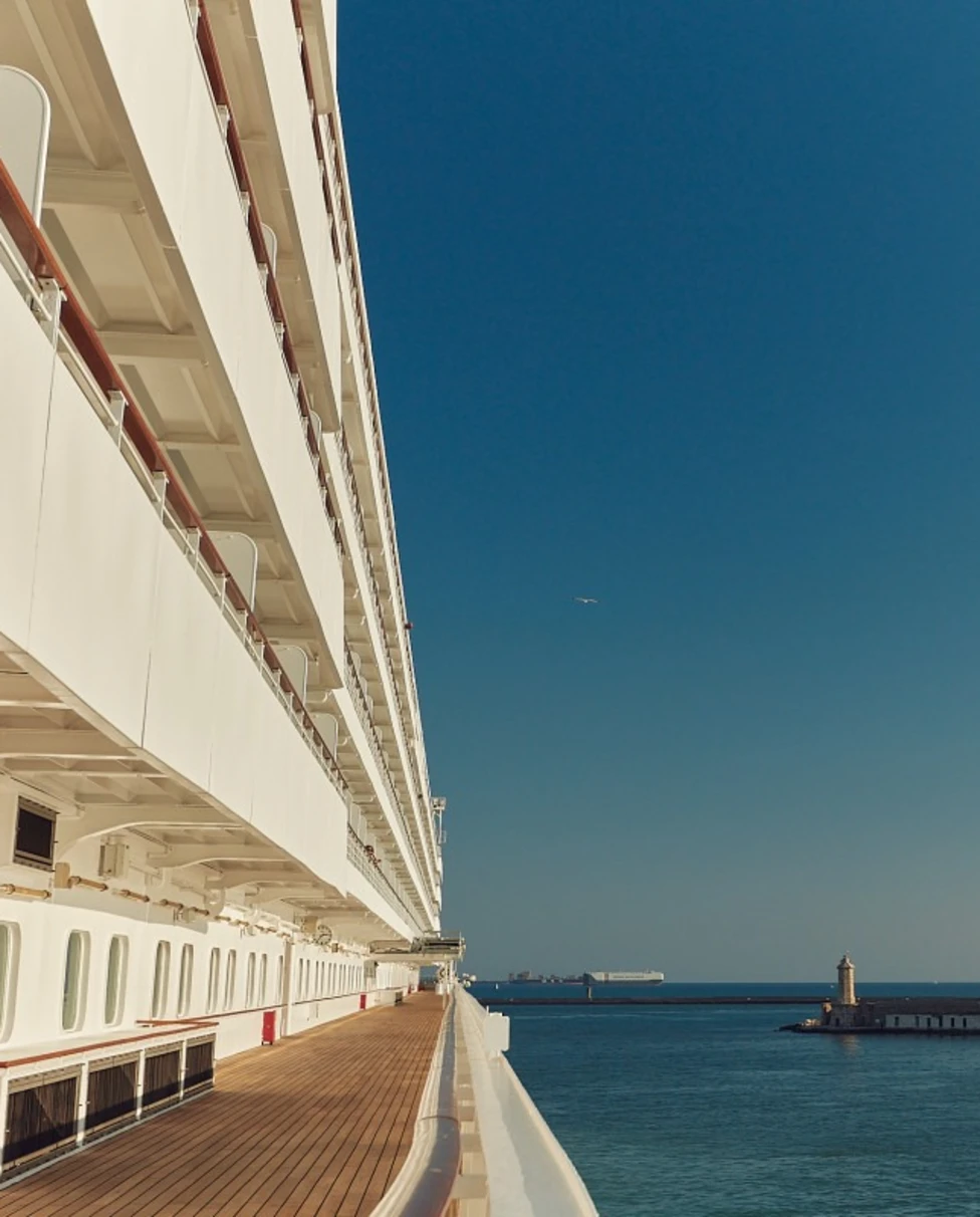 view of a wooden cruise ship deck overlooking the sea