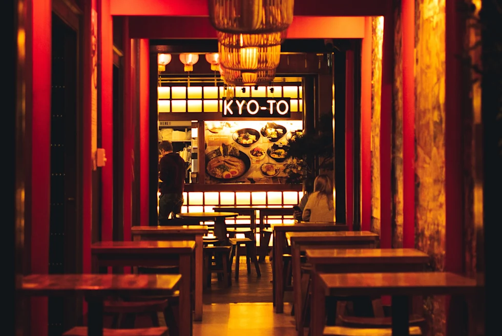 tables and chairs in a dimly lit room