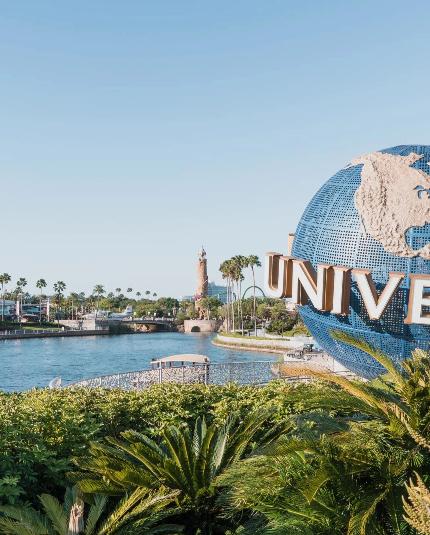 Universal Studios globe in front of water