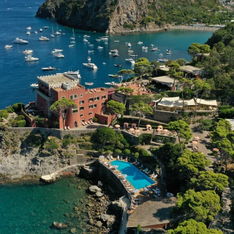 aerial view of body of water with rocky coast during daytime