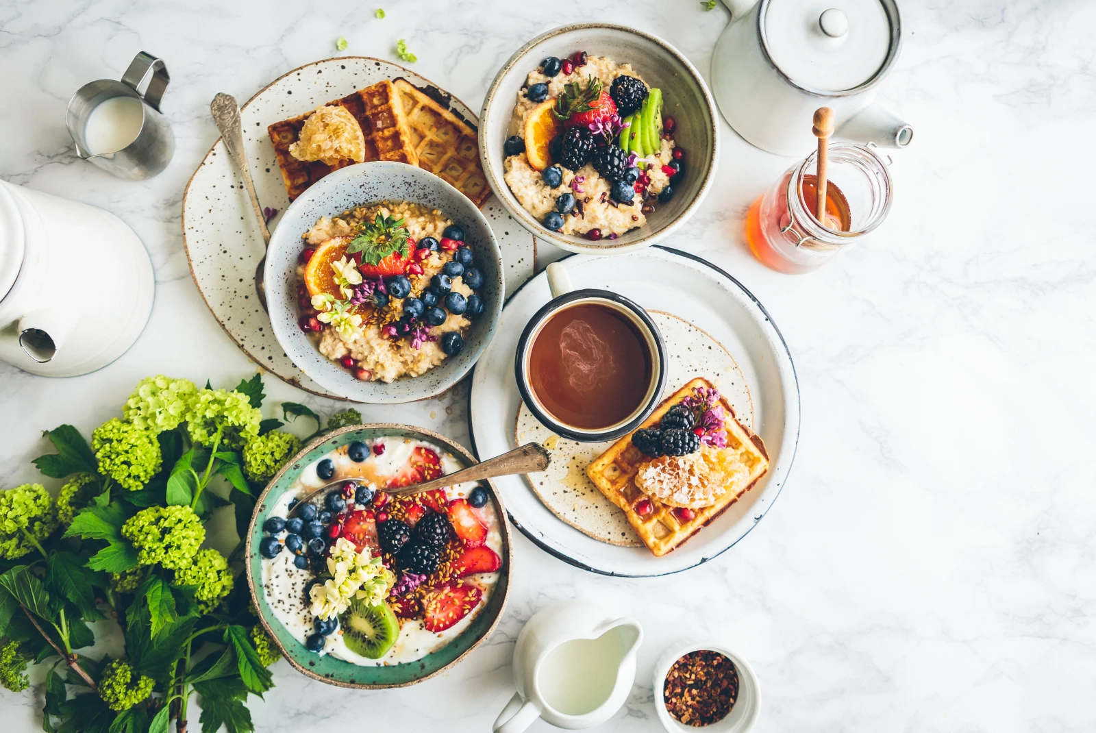 A brunch spread featuring waffles, bowls and more. 