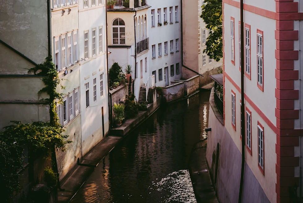 White buildings and water passing through the waterway between them