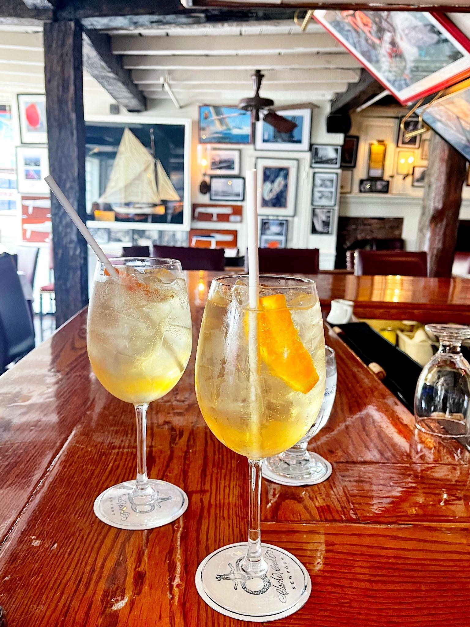 2 drinks on a table in a restaurant