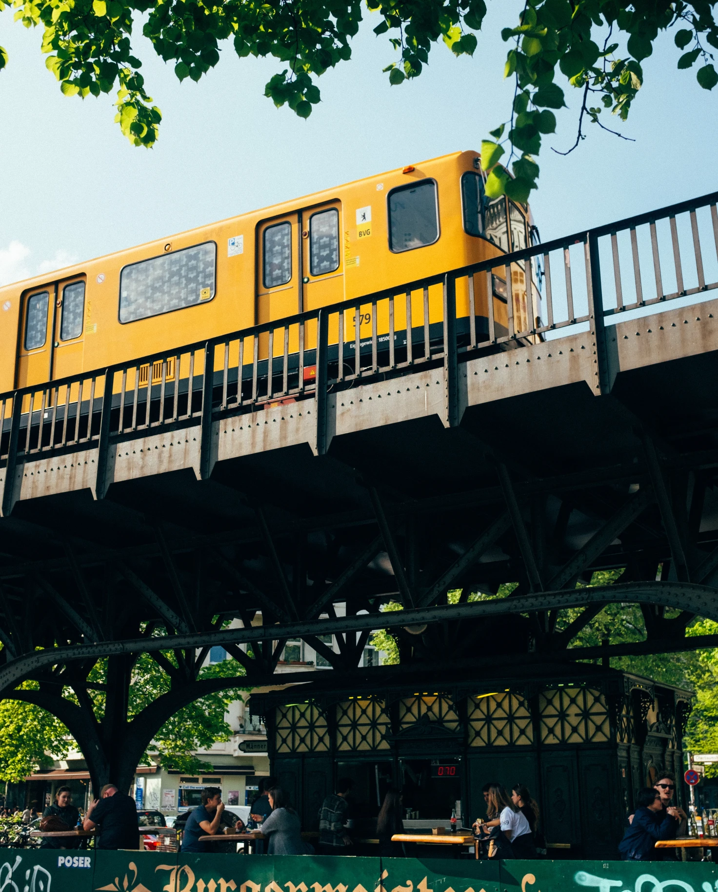 A yellow trail on a rail line in Berlin.