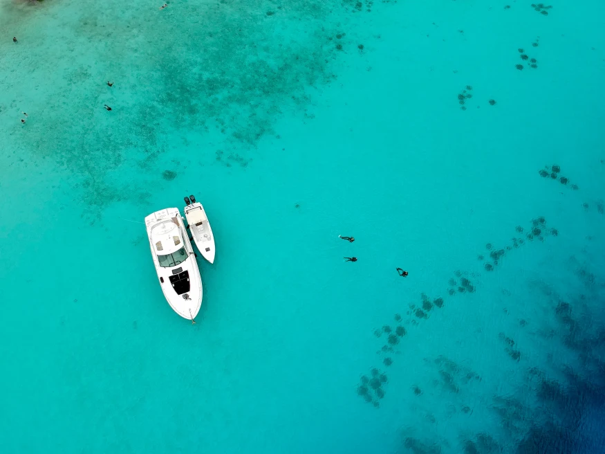 Two white boats in the blue waters in Curacao