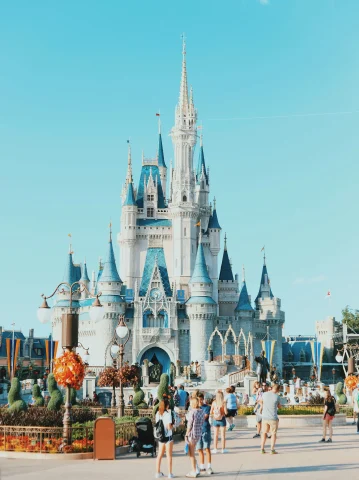 A photo of a white and blue castle at Disney during the day