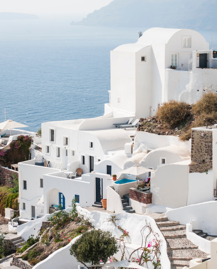 white buildings near the ocean during daytime