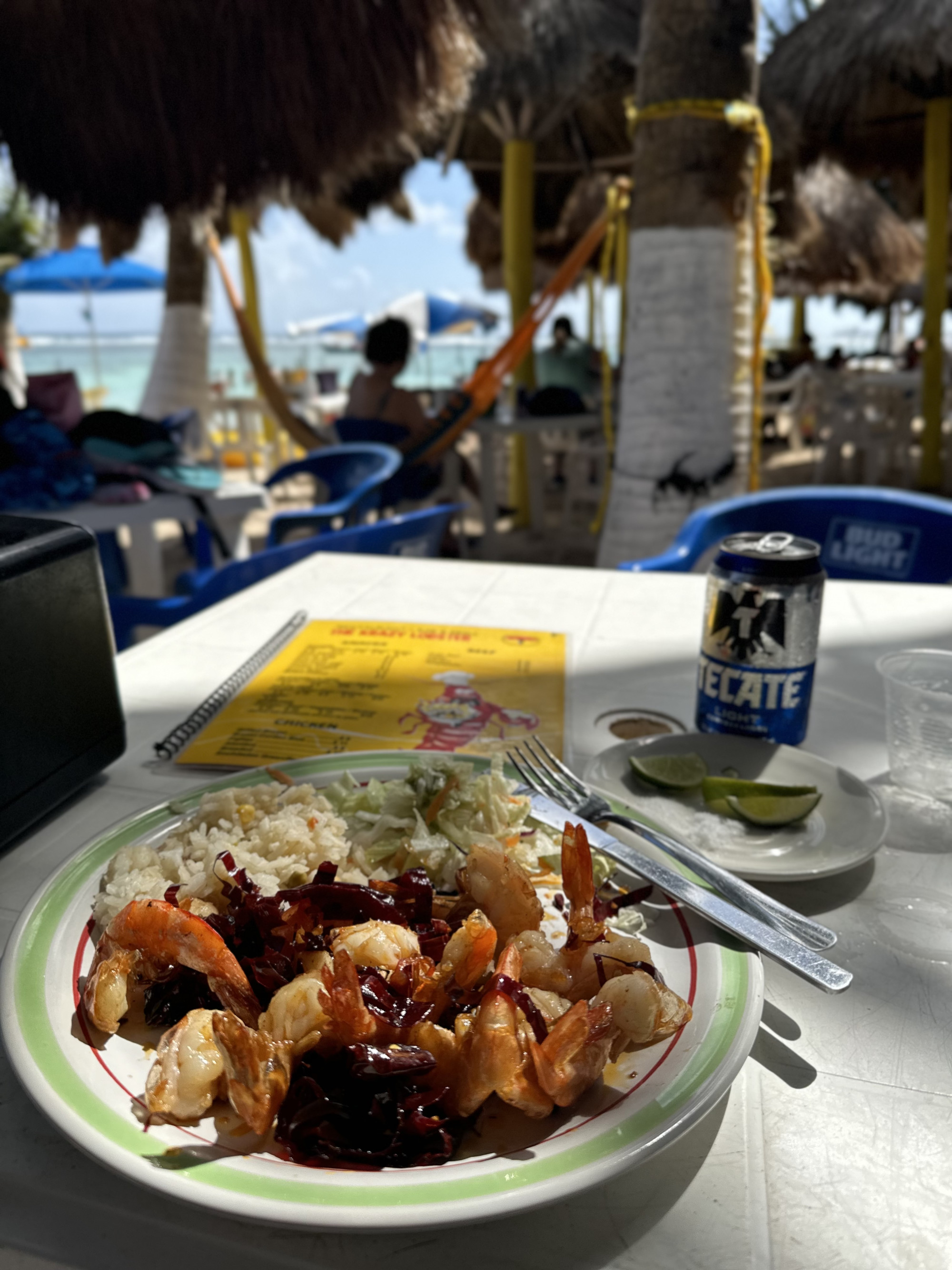 A plate of food on a table in an outside seating area