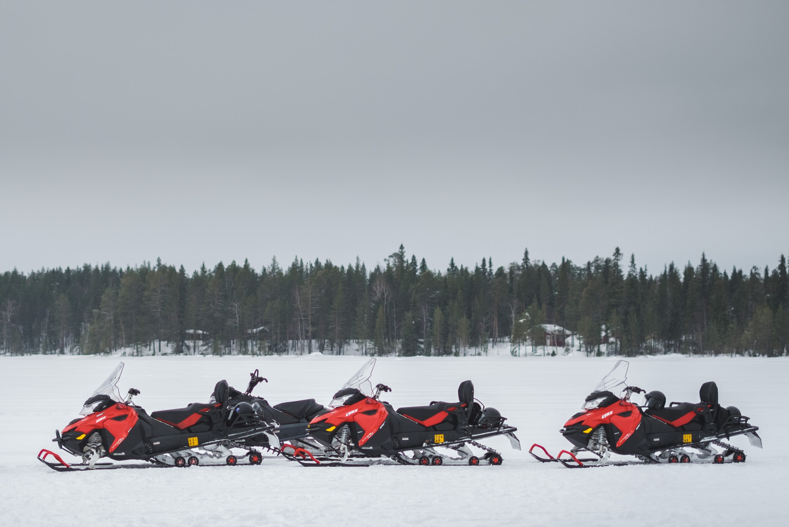 snowmobiles in the snow during daytime