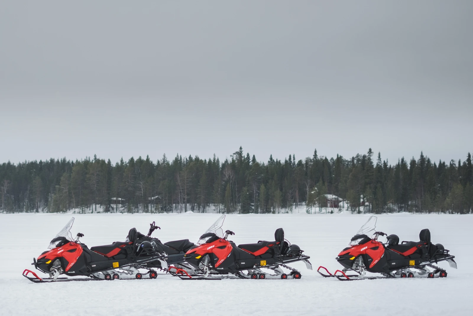 snowmobiles in the snow during daytime