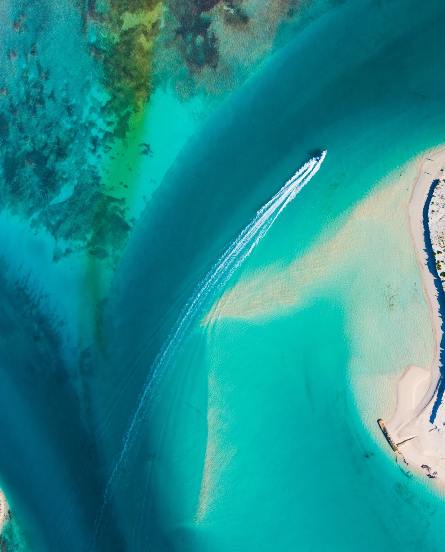 Aerial view of sea with a boat. 