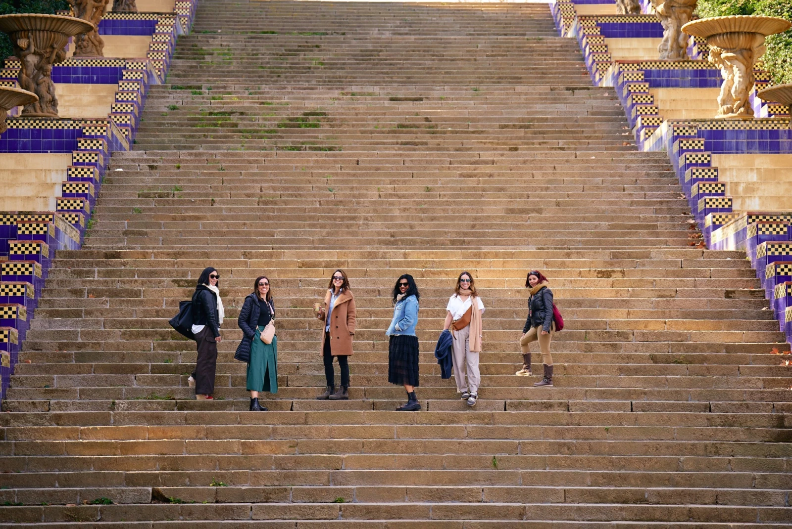 Gaya and friends posing on steps