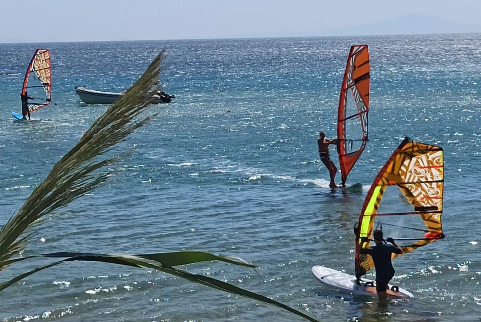 People enjoying on the boats on seaside.