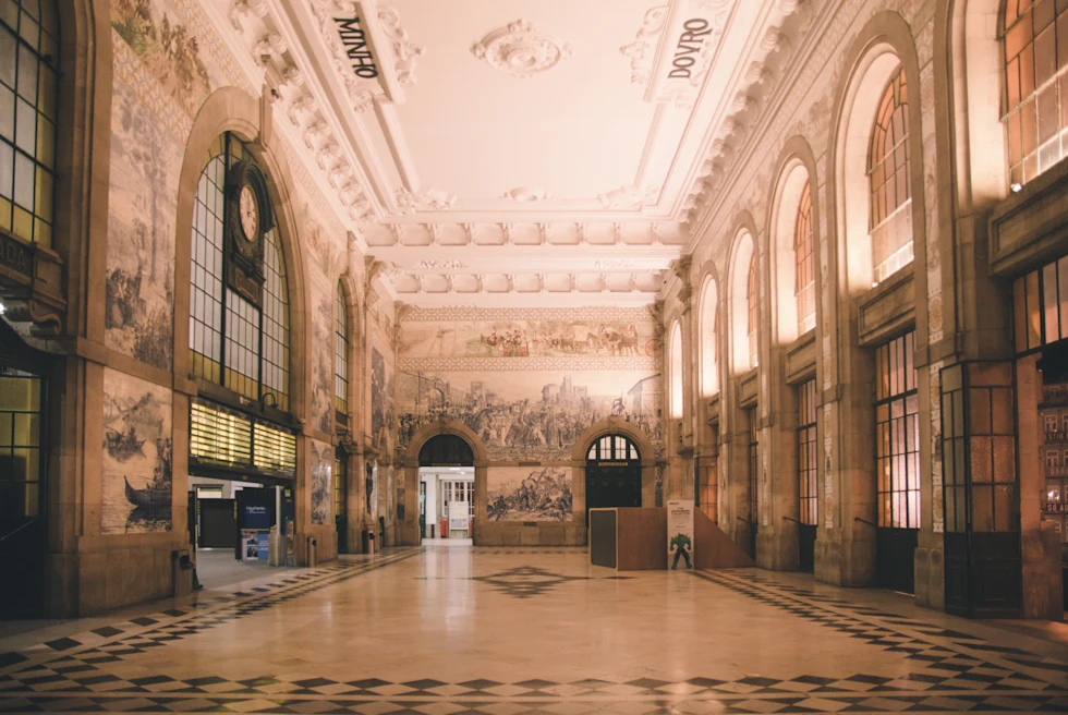 room with high ceilings, large archways and tiled floor
