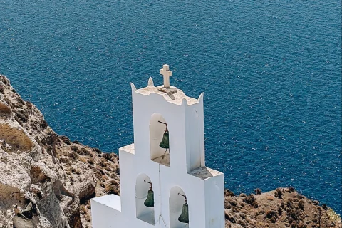 The overlooking view of the bells of Santorini church.